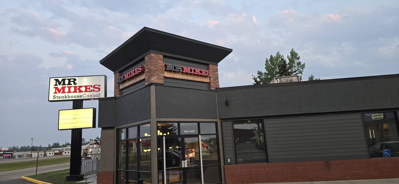 Mr. Mikes Steakhouse - Building sign at dusk