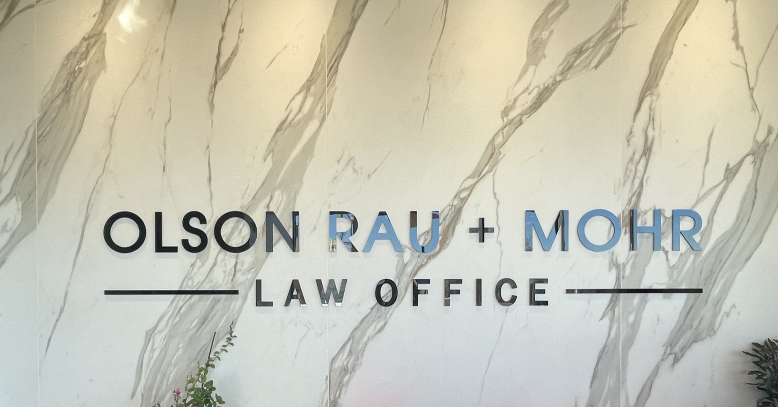 Olson Rau and Mohr Law Office dimensional interior lobby letters on a marble feature wall
