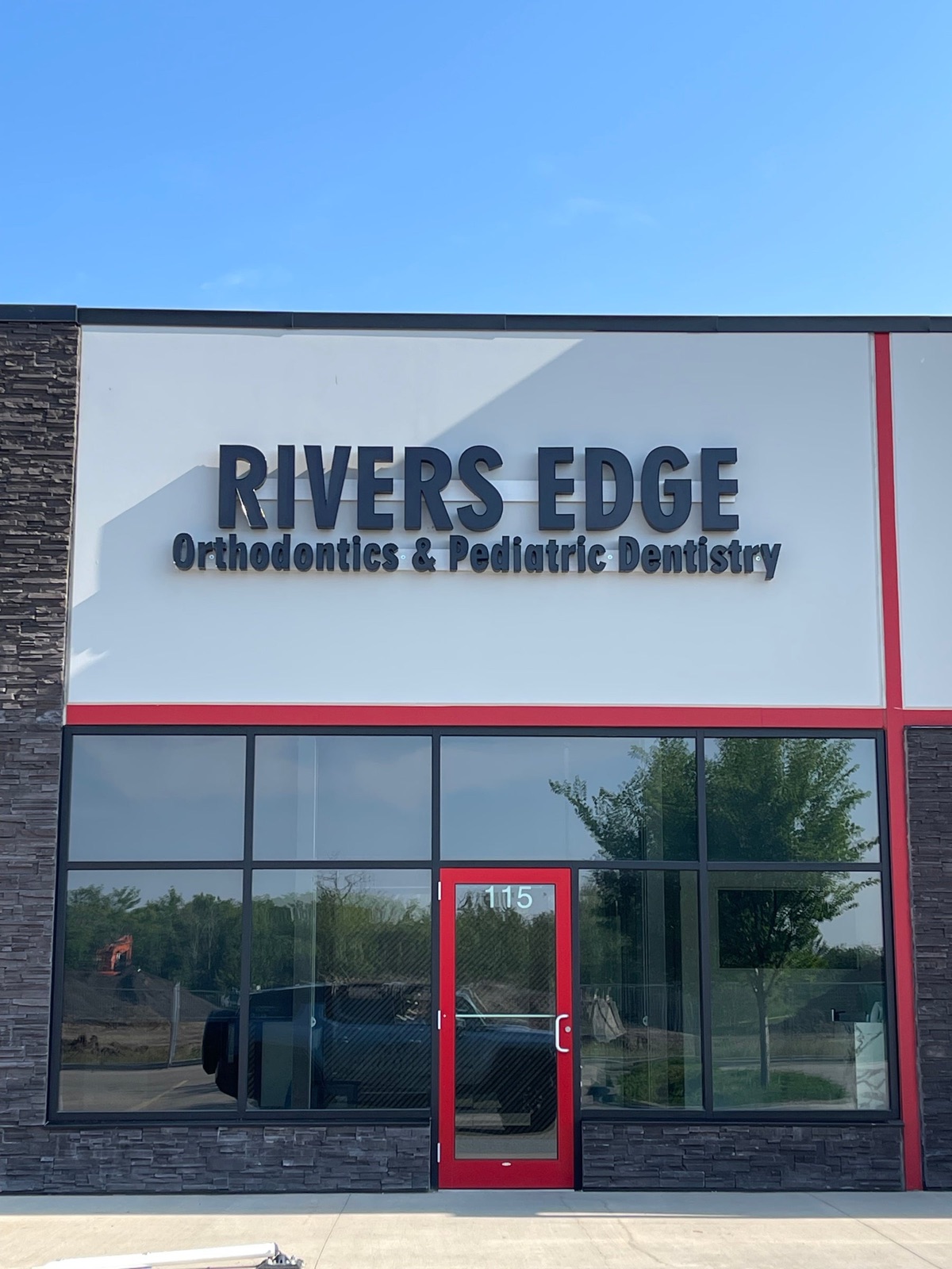Rivers Edge Orthodontics and Pediatric Dentistry channel letters on a building